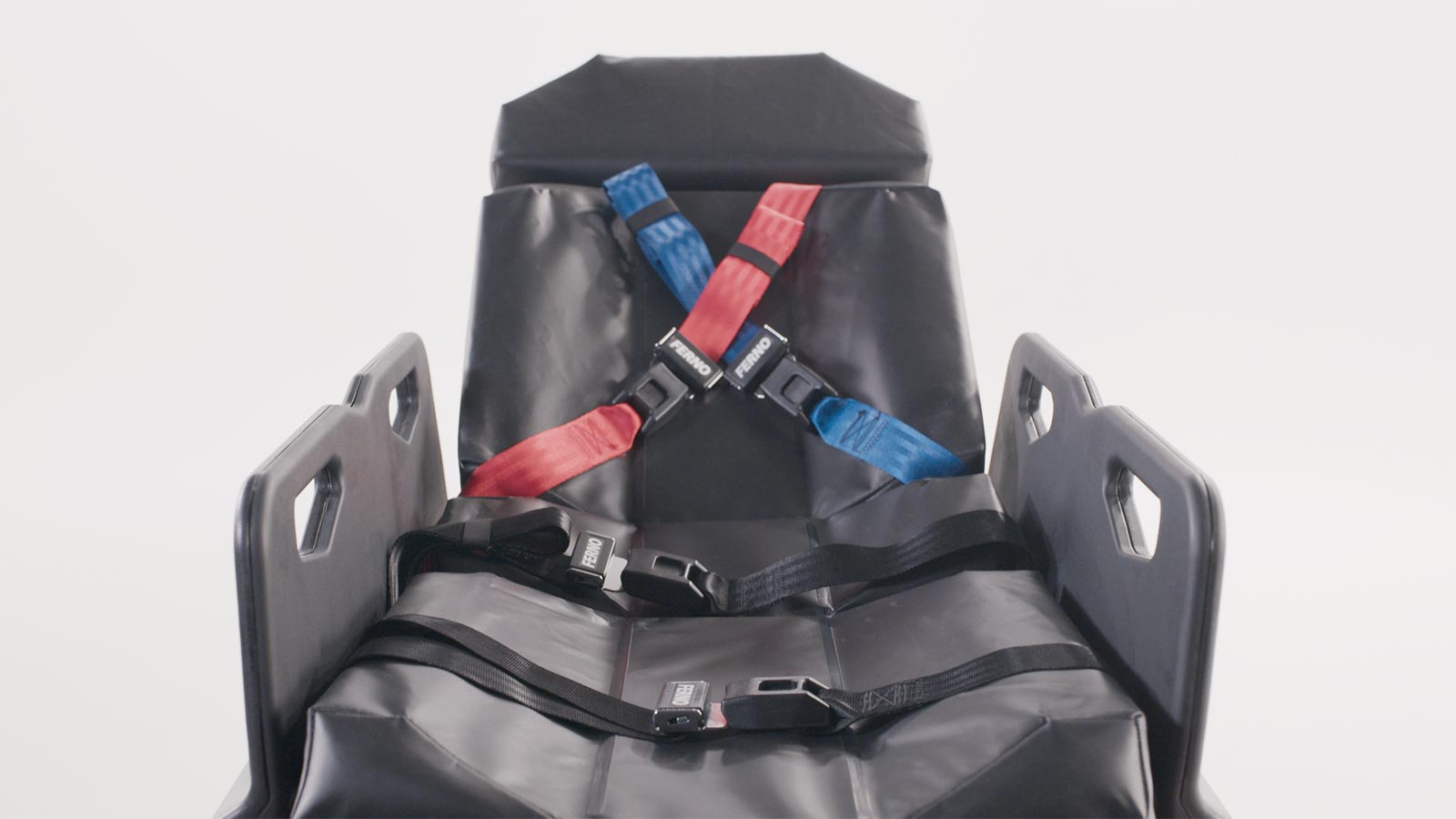 Close-up of the Ferno Power X2 sealed bolster mattress and color coded x-restraints