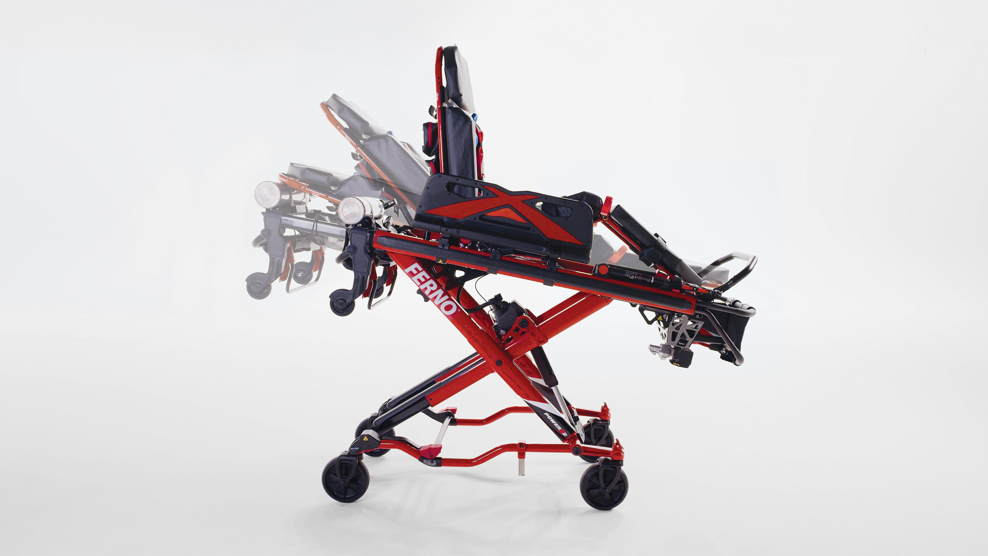 Close-up of the Ferno Power X2's adjustable features, including a raised and lowered pneumatic backrest, a raised and lowered knee gatch, and a telescoping load frame that can be extended and pushed in